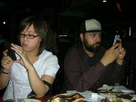 couple at dinner on phones