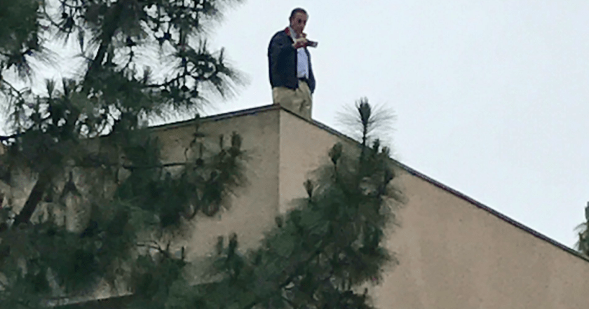 darrell on roof.png