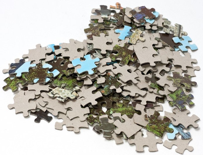 Tilted heart made of lots of jigsaw puzzle pieces