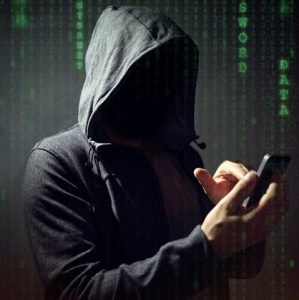 Computer hacker with mobile phone
