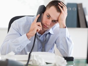 Close up of frustrated businessman on the phone