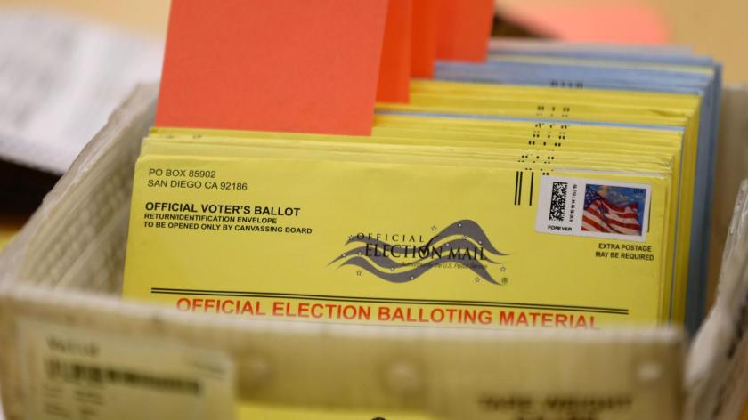 mail-in ballot with stamps